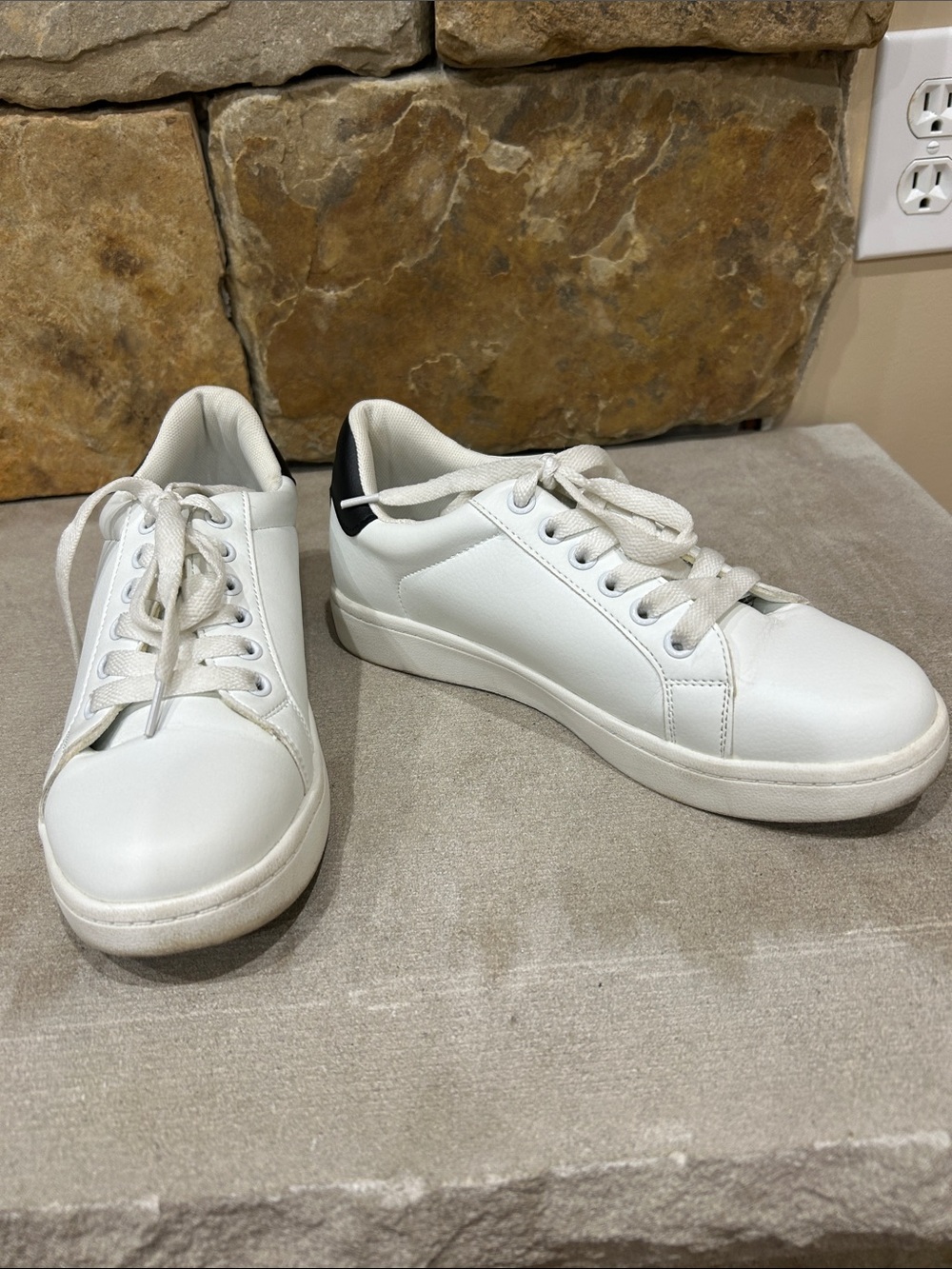 Ladies size 7 used white sneakers with black accent on heel